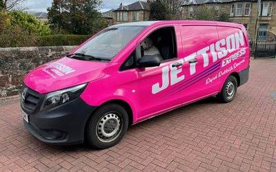 Jettison Express van parked on a residential street
