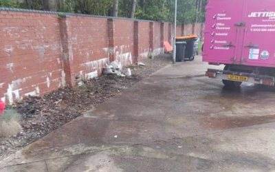 Path cleared and washed down beside a Jettison Express truck